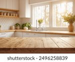 Green Empty wooden table with the bright white interior of the kitchen as a blurred background behind the bokeh golden sunshine