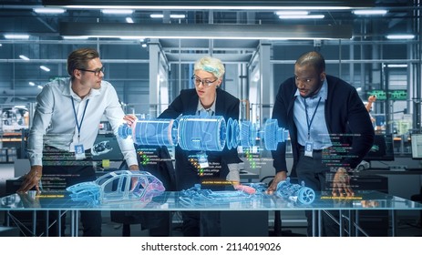 Green Energy Car Design: Diverse Team of Automotive Enginers Using Augmented Reality Hologram to Construct 3D Model of High-Tech Electric Vehicle Optimizing Engine. Automated Robot Arm Manufacturing - Powered by Shutterstock