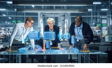 Green Energy Car Design: Diverse Team of Automotive Enginers Using Augmented Reality Hologram to Construct 3D Model of High-Tech Electric Vehicle Optimizing Engine. Automated Robot Arm Manufacturing - Powered by Shutterstock