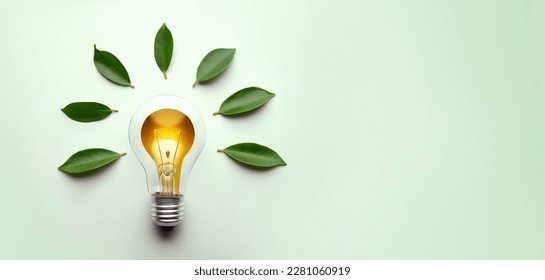 Green Energy Concepts. Wireless Light Bulb surrounded by Green Leaf as Sign of Light On. Carbon Neutral and Emission ,ESG for Clean Energy. Sustainable Resources, Renewable and Environmental Care - Shutterstock ID 2281060919