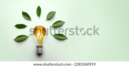 Green Energy Concepts. Wireless Light Bulb surrounded by Green Leaf as Sign of Light On. Carbon Neutral and Emission ,ESG for Clean Energy. Sustainable Resources, Renewable and Environmental Care