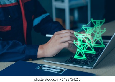 Green energy electrical services concept. Electrical engineer use computer laptop checking and analysis data of power plant station project, internet system network, electric, green energy Industry