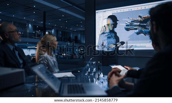Green Energy Technology Conference Presentation:\
Chief Female Automotive Engineer Sustainable Environmental Engine\
Design to Investors and Businesspeople. Screen Shows 3D Model of\
Electirc Turbine