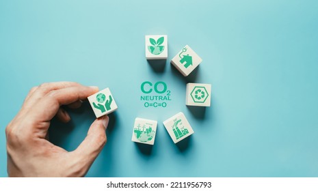 Green Energy Wooden Cube Icon. Industrial Emissions Pollute The Environment And Ecosystems. Including Climate Change Carbon Renewable Energy Agreement Reduce Greenhouse Gas Emissions Concept.