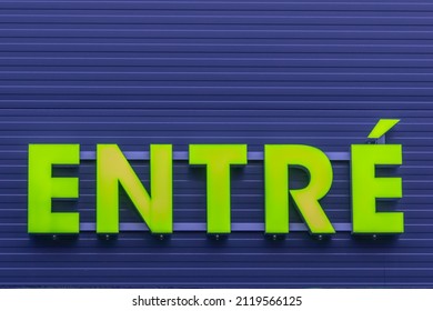 Green Enter Sign On Blue Background Wall.