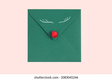 Green Envelope With White Sheet And Christmas Branch Isolated On White Background. Christmas Mail. Concept Of Congratulation For Christmas Or New Year. Top View. Flat Lay. Copy Space