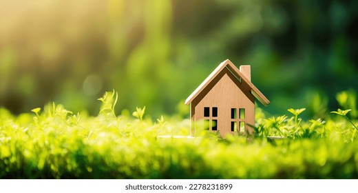 Green and environmentally friendly housing concept. Miniature wooden house in spring grass, moss and ferns on a sunny day. Eco house - Powered by Shutterstock