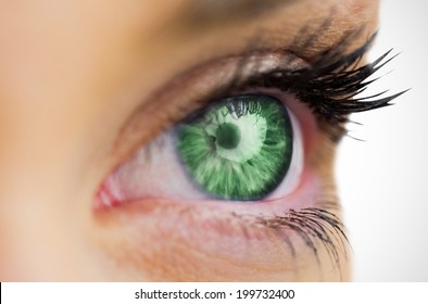 Green eye looking on female face on white background