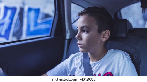 Green Eyes Kid In A Back Seat Of The Car