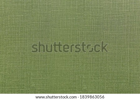 Green fabric texture surface for interior wall design. Olive color seamless textile for nature of peace feeling for architecture or construction of hotel or fancy restaurant.