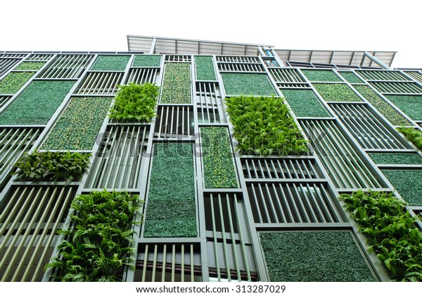 Green facade, vertical garden in\
architecture. Ecological building. Green\
architecture