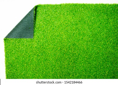 The Green Fake Grass Floor Is Folded In The Corner.