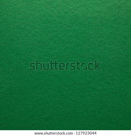 Green felt as background or texture.