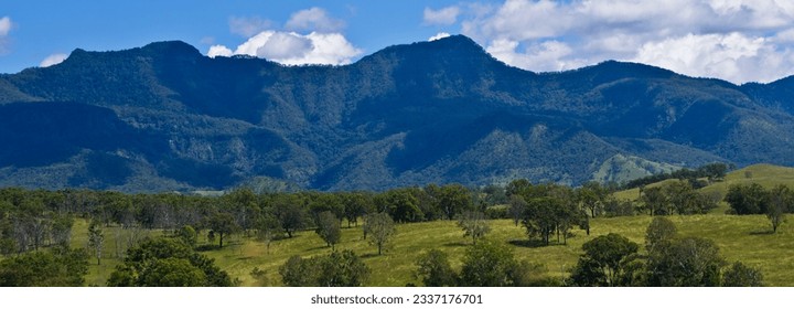 Green fields with mountains behind