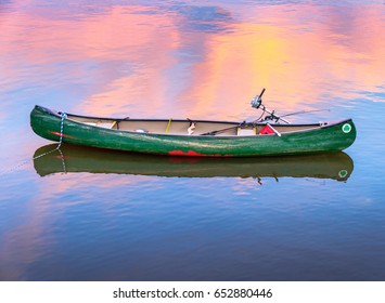Green Fishing Canoe at Dusk