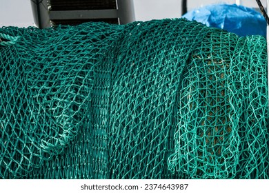 Green fishing trawl ned on a fishing boat. - Powered by Shutterstock