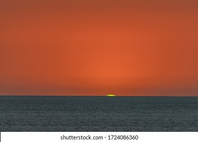 The Green Flash At Sunset Over The Pacific.