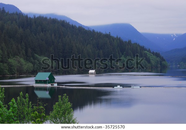 Green Floating Cabin On Peaceful Lake Stock Photo Edit Now 35725570