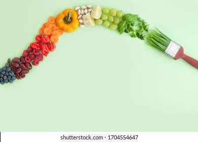 Green food brush 'stroke' with assorted colourful food groups, including fruits, vegetables, nuts and grains