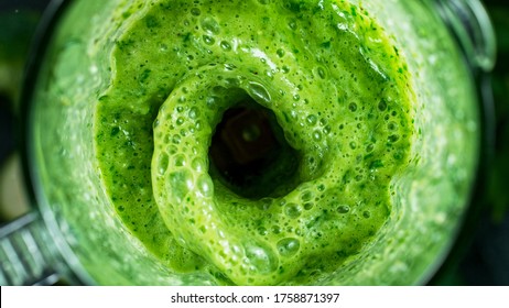 Green fresh smoothie blended in blender, top view. Healthy eating concept. - Shutterstock ID 1758871397