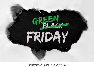 Green Friday Concept With Hole Burned In White Paper. Text 