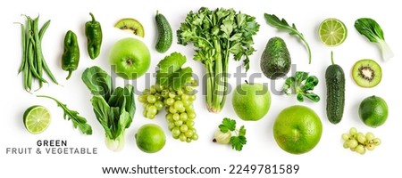 Green fruit and vegetable mix collection. Celery, apple, avocado, cucumber, bean, rucola, grape, bok choy, lime, grapefruit, kiwi, pepper isolated on white background. Creative layout. Flat lay
