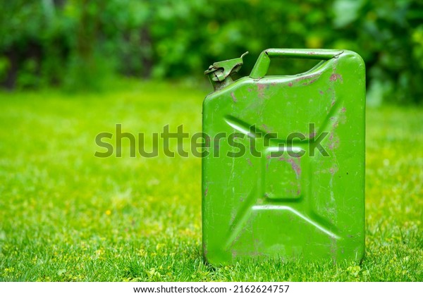 \
green fuel container on\
green grass