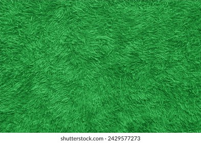 Green fur texture top view. Green sheepskin background. Fur pattern