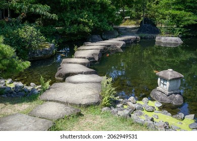 Green Garden With Bonsai Trees And Fish Pond In Himeji, Japan.