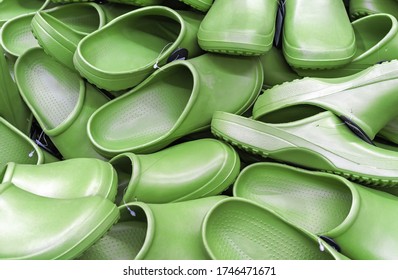 Green Garden Shoes (clogs) On The Counter Of The Store.