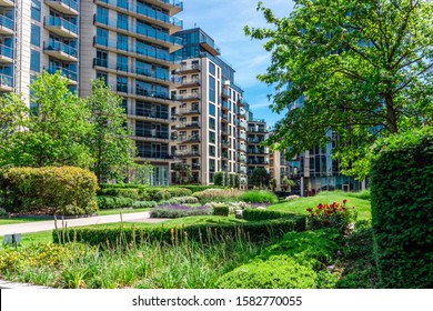 Green Garden Within Apartment Building Complex In Battersea Reach During Summer Time.