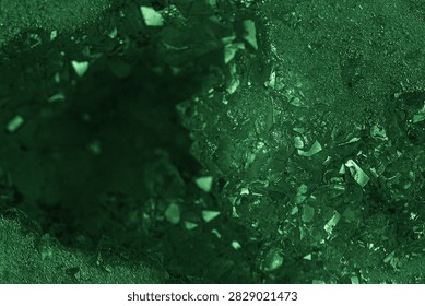 Green geode interior with rough texture and crystal facets.
