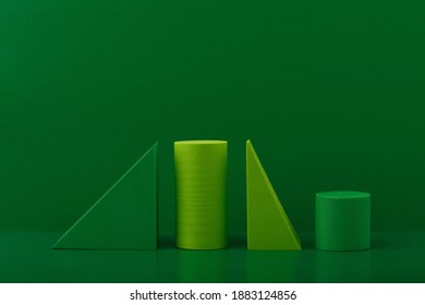 Green Geometric Figures Against Green Background. Abstract Monochromatic Background Concept With Space For Text