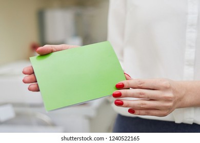 Green Gift Certificate In Hand
