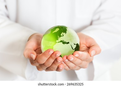 Green Glass Globe In Hand