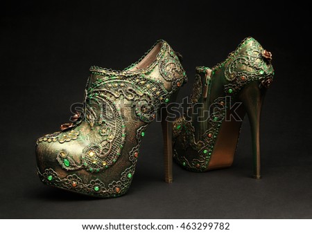 Green  glitter female glamour shoe isolated on background