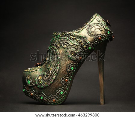 Green  glitter female glamour shoe isolated on background