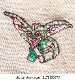 Green Goblin Embroidered By Hand On Fabric Close Up