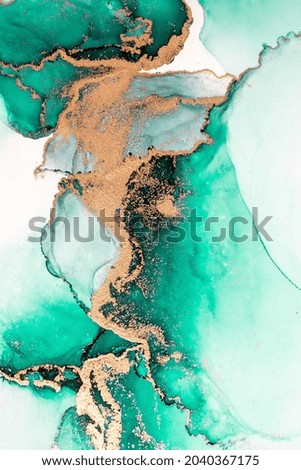 Green gold abstract background of marble liquid ink art painting on paper . Image of original artwork watercolor alcohol ink paint on high quality paper texture .