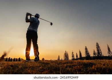 green, golf, ball, club, course, golfer, grass, sport, golfing, fairway. sunset silhouette image with a male pro golf player on a professional golf course. Golfer with golf club taking a shot.