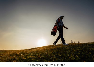green, golf, ball, club, course, golfer, grass, sport, golfing, fairway. silhouette golf player walking away with a golf bag to next course or next shot, at the sunset sky and hill background