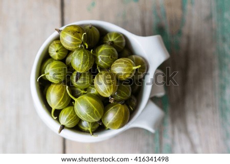 Similar – Image, Stock Photo Top view of organic gooseberries in a vintage bowl