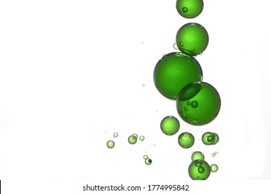 Green gradient liquid bubbles flows over a white surface. - Powered by Shutterstock - Get 15% off with code: PIKWIZARD15