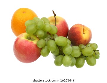 green grapes in an environment of tasty fruit on a white background