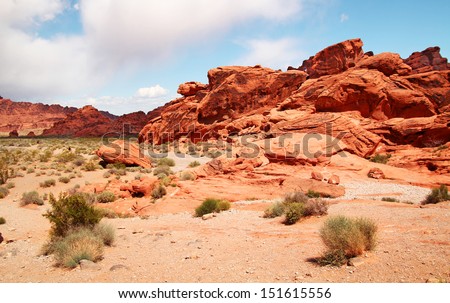 Green grass in foreground and red rocks at Valley of fire, Nevada