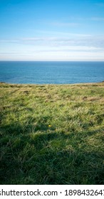 Green Grass Hill And Sea Horizon