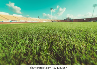 Green grass in soccer stadium , vintage tone