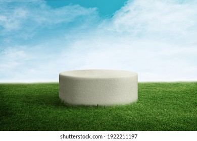 Green Grass Texture with a 3d white podium or stand made from stone or concrete with blue sky 
