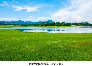 Green Grass Yard With Lake, Thailand.