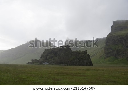 Green Grassy mountain Landscape in the highlands. Travel and nature on a beautiful cold day